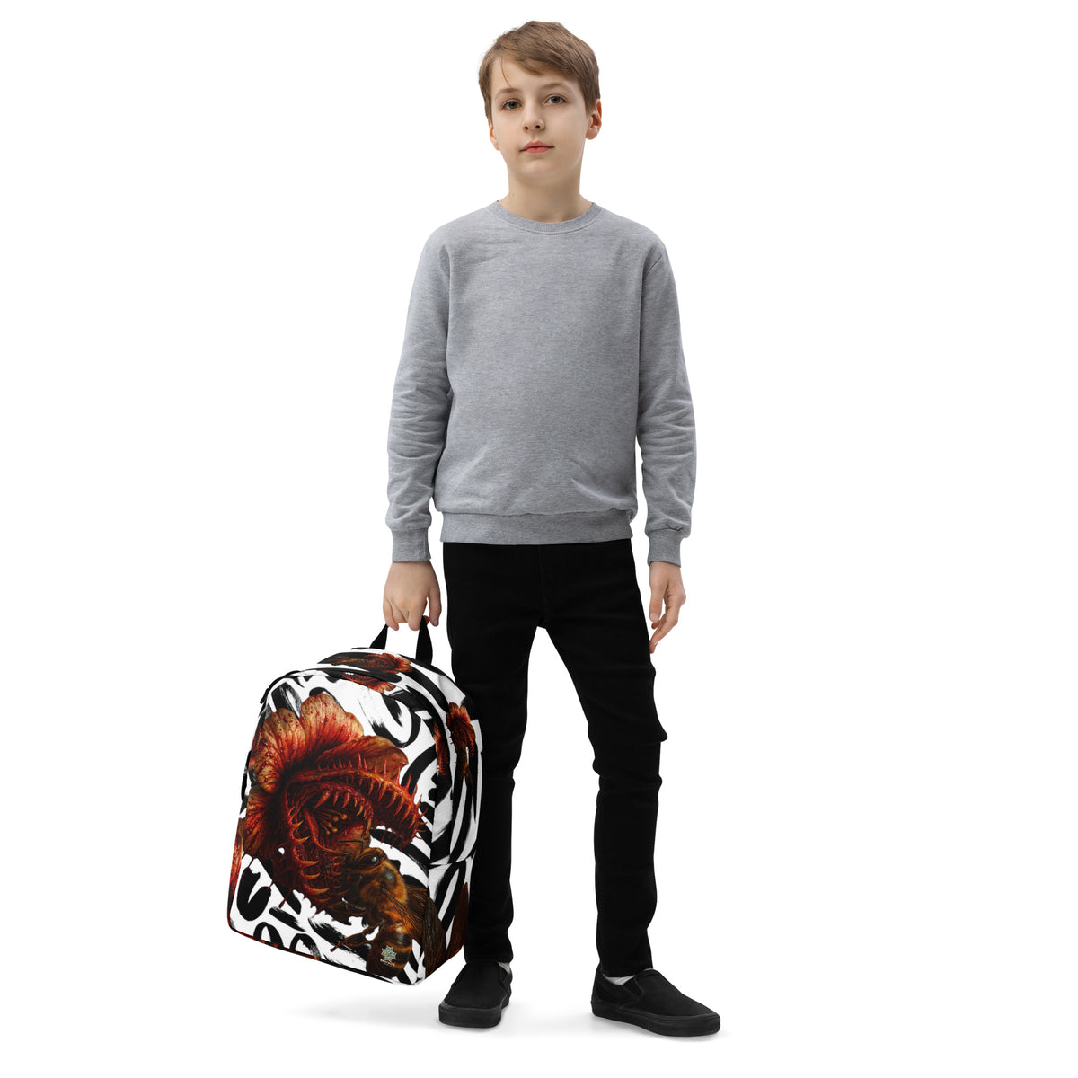 Backpack from Honest Hustle World — BLOOM Trap & Truth flower-and-bee graphic, left-front view